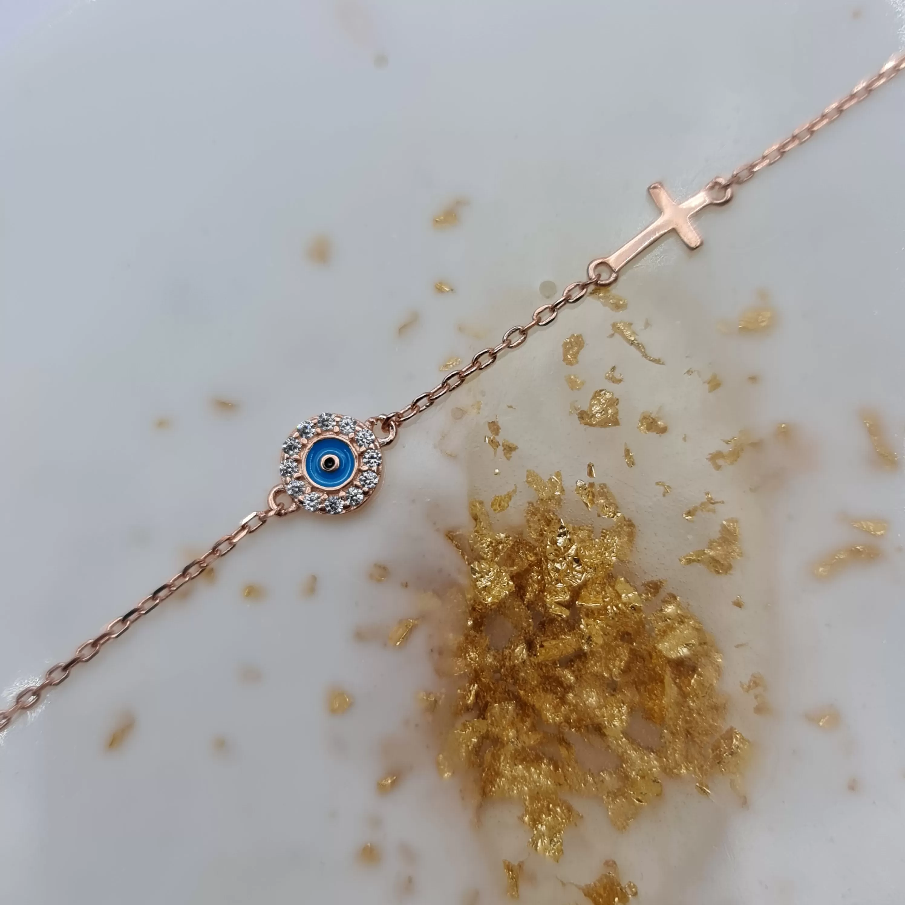 Dion blue evil eye and cross cz bracelet in rosegold